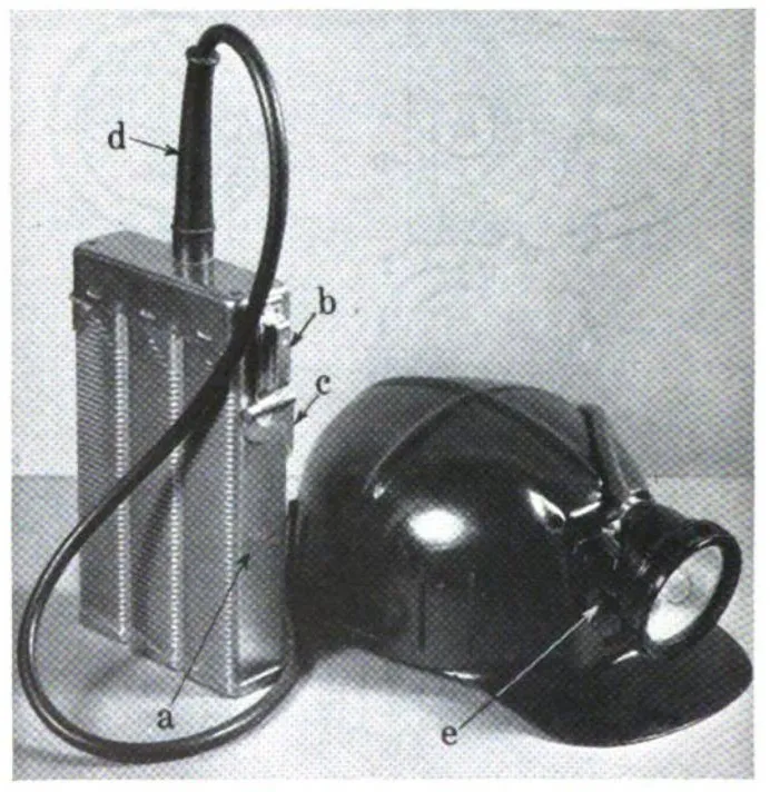 Edison model P cap lamp mounted on miner's safety cap.
