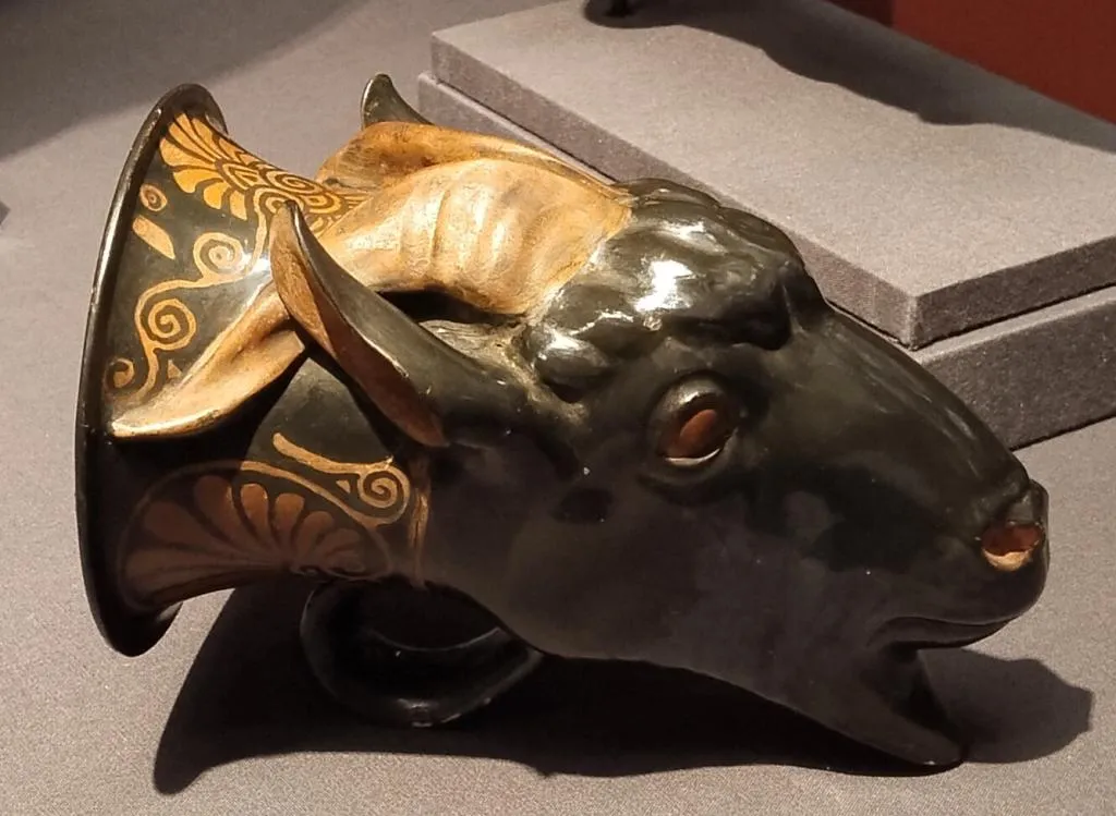Ceramic rhyton shaped as a goat’s head with red-figure decoration, dating to around 400 BC, from Attic Greece.