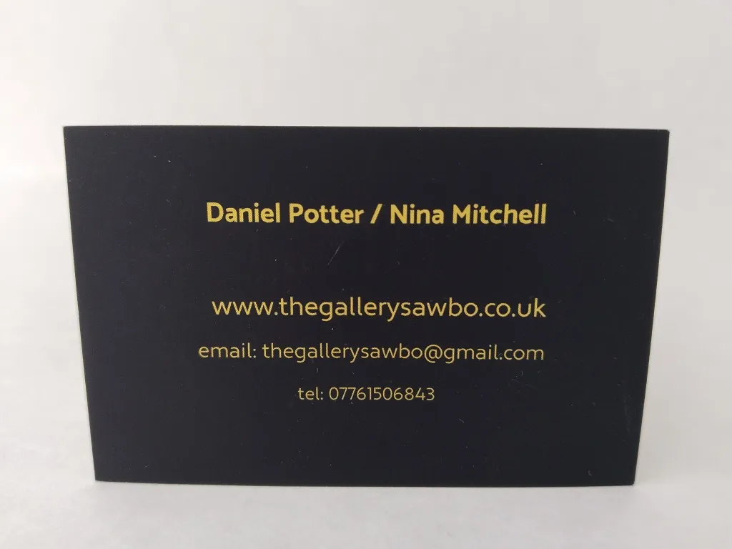Business card of The Gallery Antiques, featuring contact information for owners Daniel Potter and Nina Mitchell.
