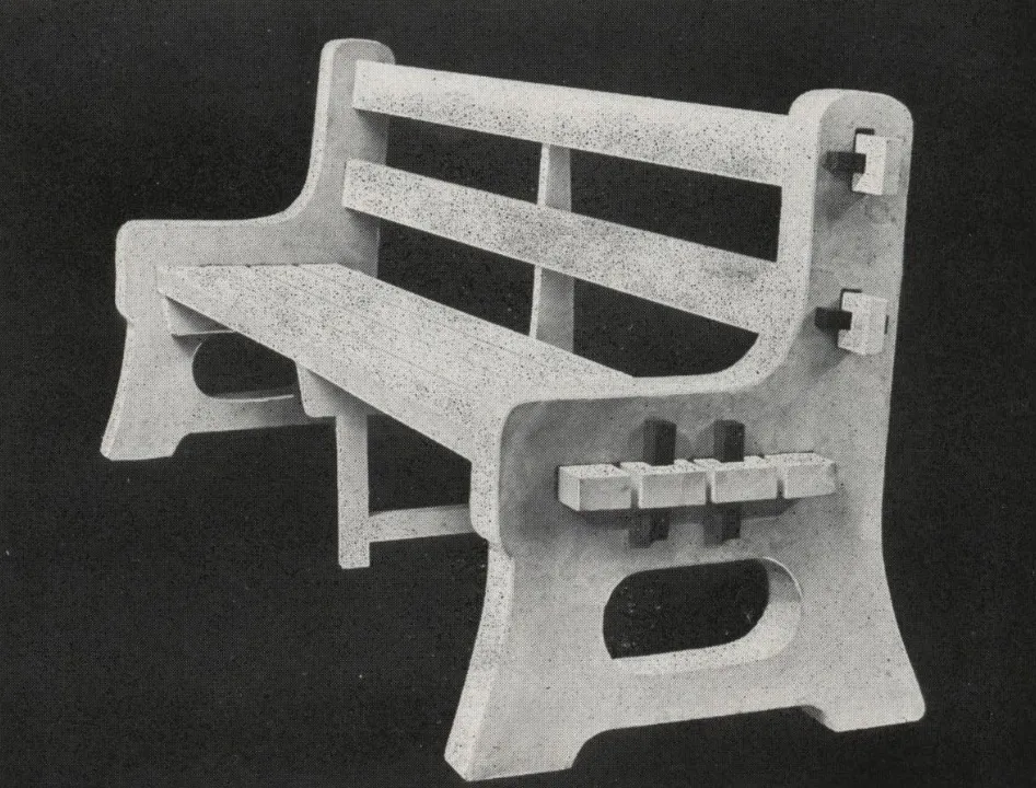 Black-and-white catalog photograph of a sturdy park bench featuring thick cast-concrete side supports with rectangular cut-outs and exposed connector details, combined with a wooden slatted seat and backrest in a simple, durable design.