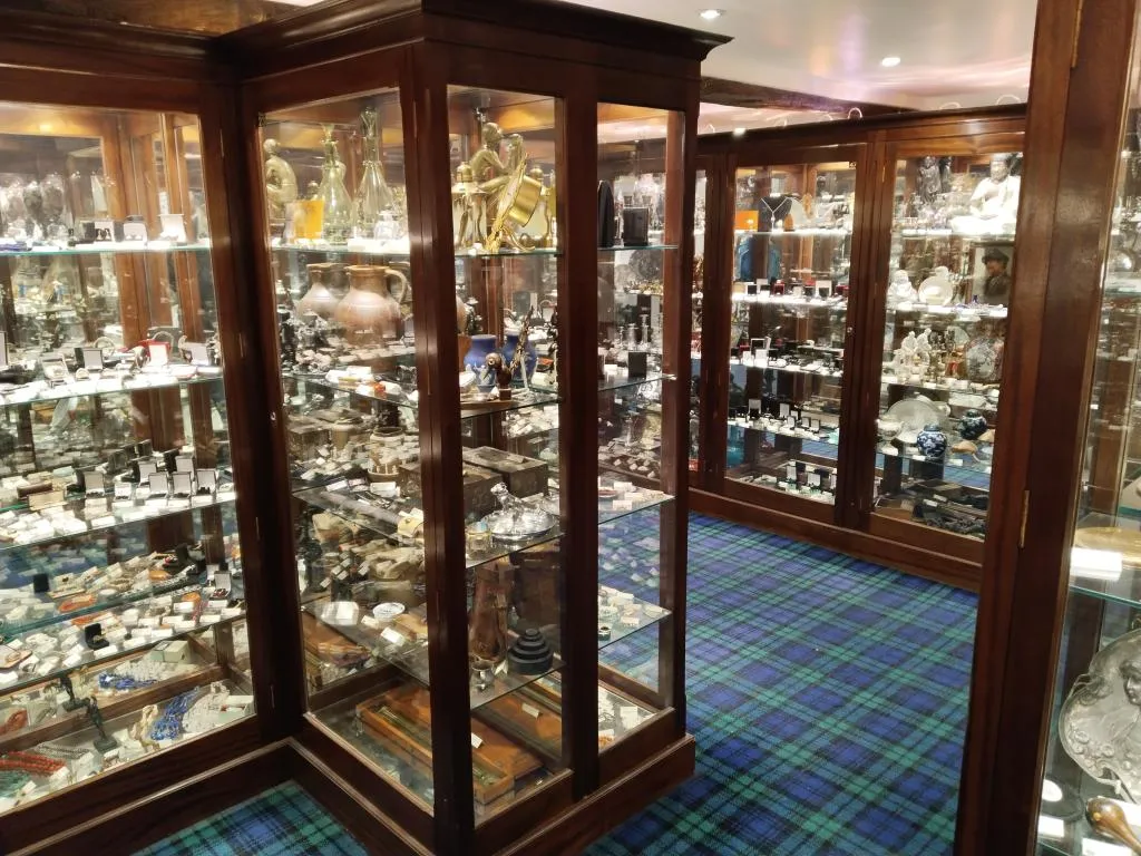 Inside Cromwell’s Antique Centre: a treasure trove of neatly curated display cabinets, packed with vintage jewellery, ceramics, timepieces, and collectibles.