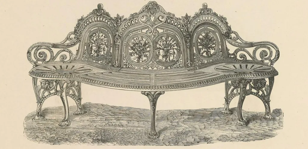 Antike Darstellung einer kunstvoll gestalteten Gartenbank aus Gusseisen mit aufwendig verzierten Blumenmotiven, geschwungenen Armlehnen und elegant geformter Sitzfläche im viktorianischen Stil.