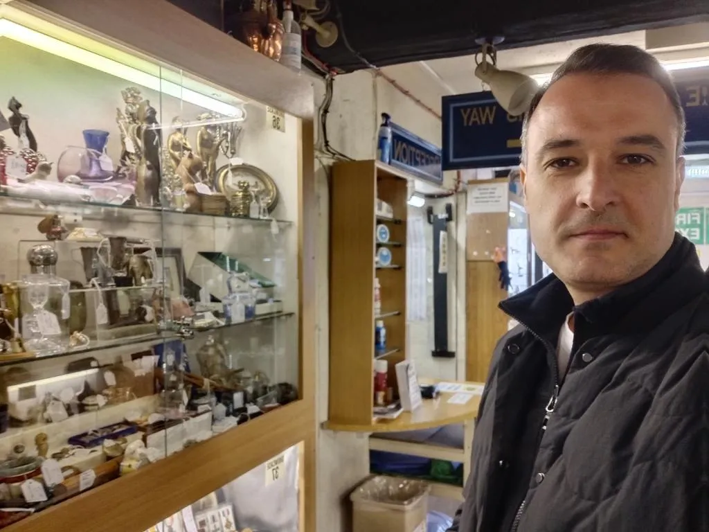 Glass cabinet with smalls near the cash desk on the ground floor.