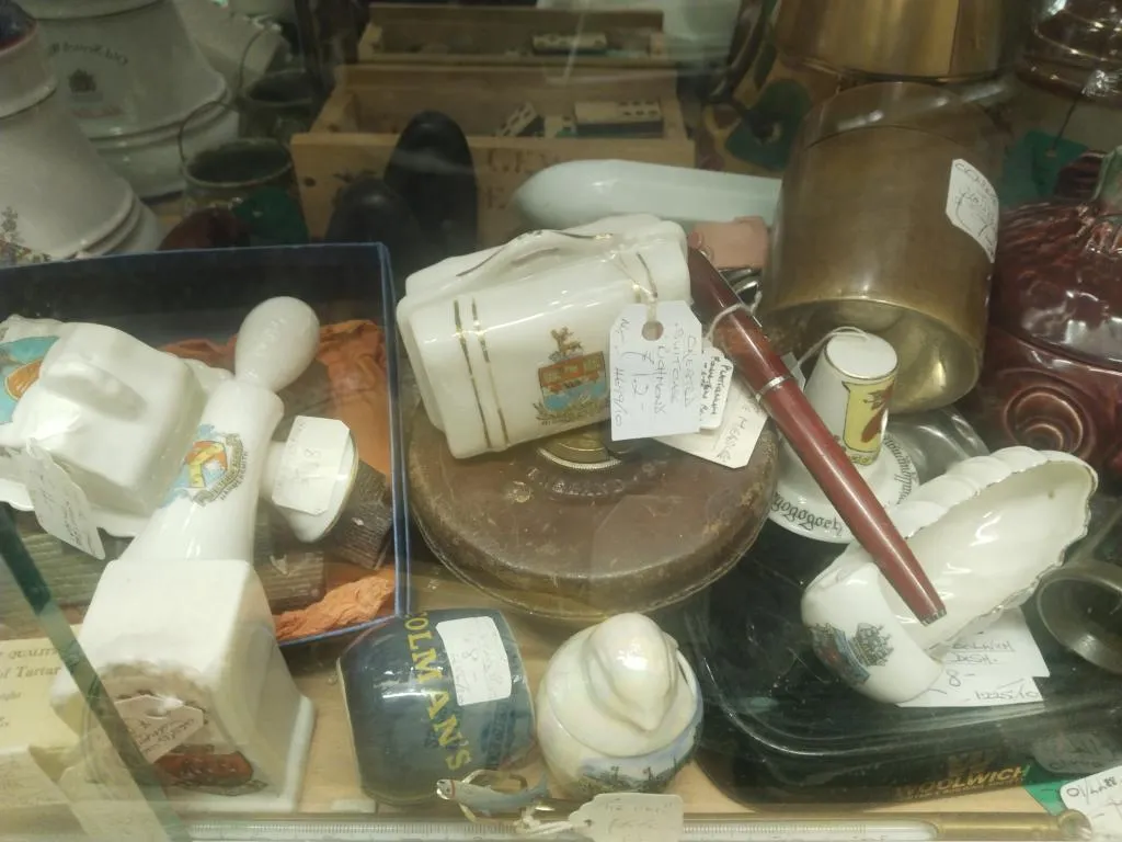 Vintage John Rabone & Sons metal tape measure with leather case, among assorted smalls.