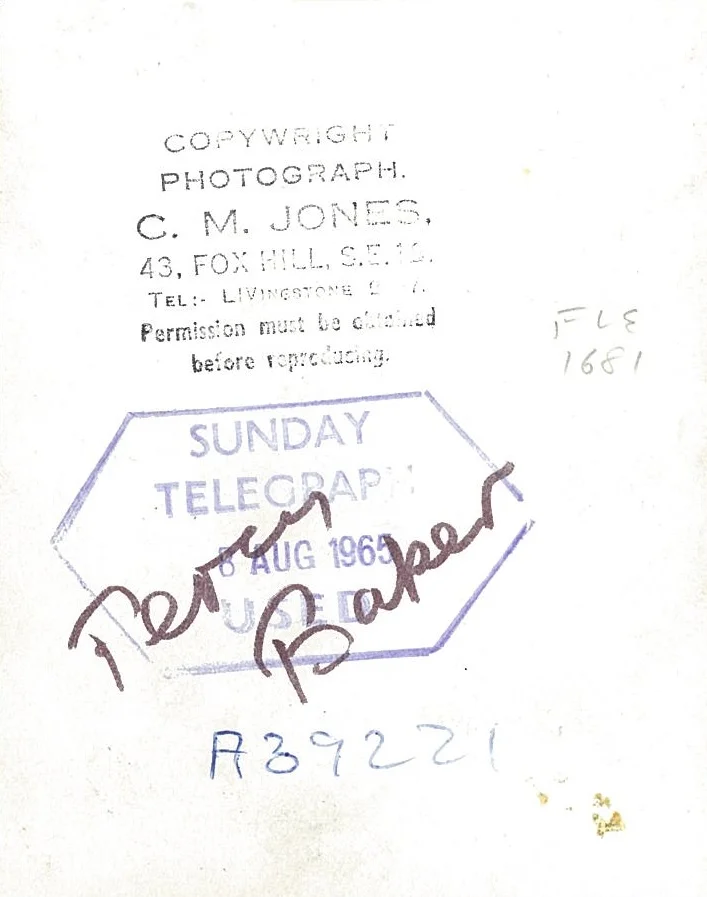 Percy Baker at the green, rolling a lawn bowl on August 8, 1965 -, reverse side