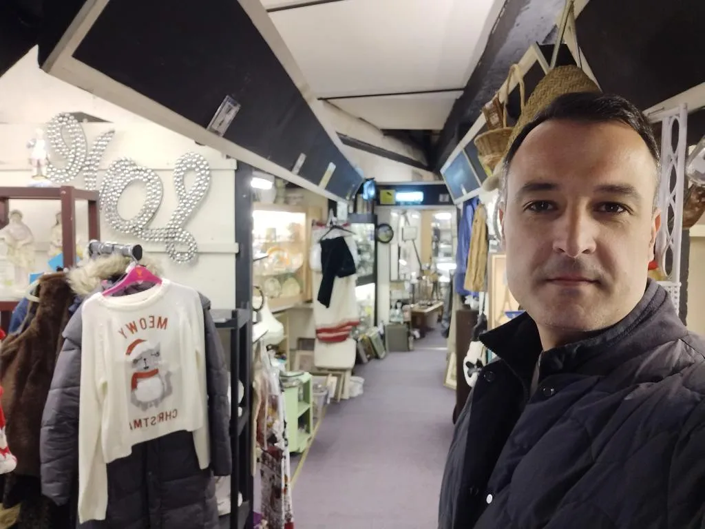 Eclectic mix of vintage fashion and homewares in the second-floor corridor.