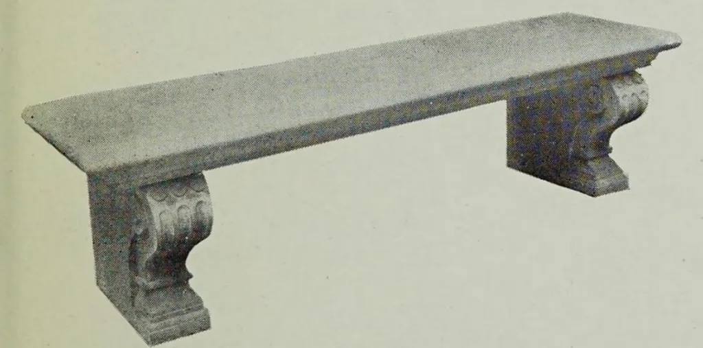 Vintage illustration of an elegant stone garden bench featuring a long rectangular stone seat resting on two carved pedestal supports with classical ornamental detailing.