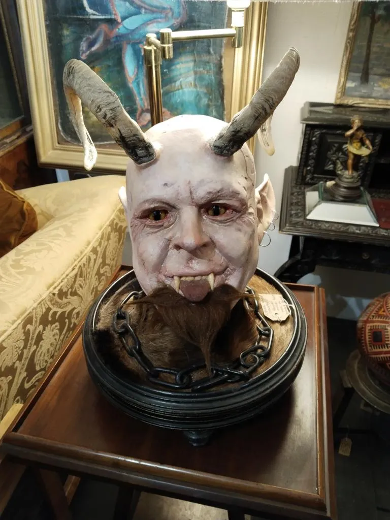 Handcrafted Faust Devil sculpture, featuring detailed horns, fangs, and a goatee. A unique and striking piece found at The Gallery Antiques.