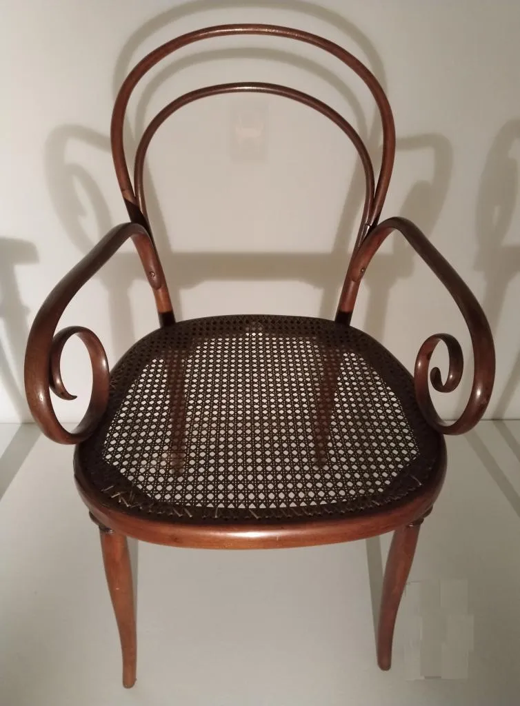 Thonet armchair model no. 8 in solid bent beech with rare original armrest design and cane seat, brown stained, designed by Gebrüder Thonet around 1855, produced by Gebrüder Thonet circa 1860.