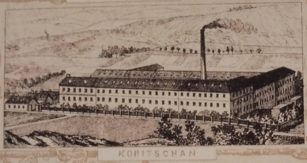 Stich der Thonet-Fabrik in Koritschan, Mähren, mit großem Fabrikgebäude, rauchendem Schornstein und umliegender Hügellandschaft.