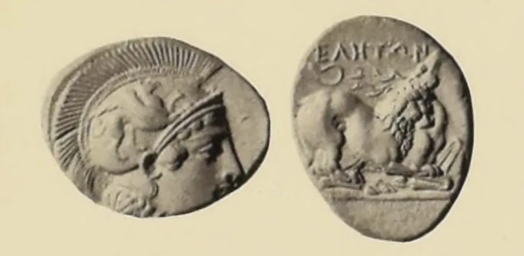 Black-and-white two-sided plate image of an ancient Greek silver stater from Velia in Lucania. The obverse shows Athena facing right, wearing a crested helmet with a griffin on it. The reverse shows a lion devouring a stag, with the ethnic inscription above.