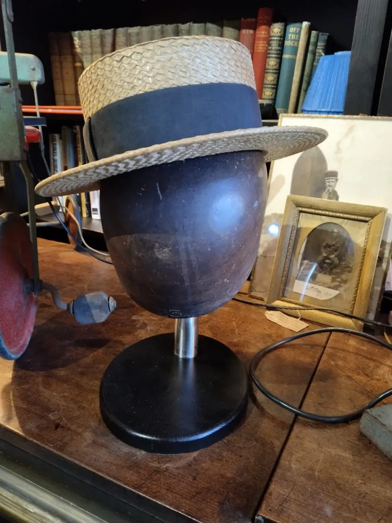Wooden tabletop hat holder, a vintage millinery display from the 1960s. A charming addition to any collection, found at The Gallery Antiques.