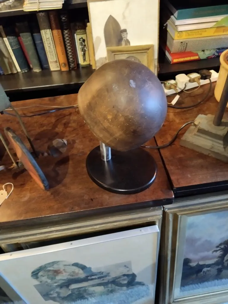 Another view of the hat stand displayed without the hat.