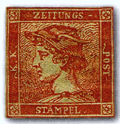 Ein Bild der Briefmarke „The Red Mercury“ (Zinnoberrote Merkur). Die Briefmarke hat eine quadratische Form mit einem verzierten roten Rand, der in jeder Ecke kleine Blumendesigns zeigt. Innerhalb des Randes befindet sich ein detailliertes Profilbild von Merkur, dem römischen Gott, in Rot dargestellt. Die Worte „ZEITUNGS“ oben, „K.K.“ und „POST“ an den Seiten und „STÄMPEL“ unten sind innerhalb des Randes eingraviert.